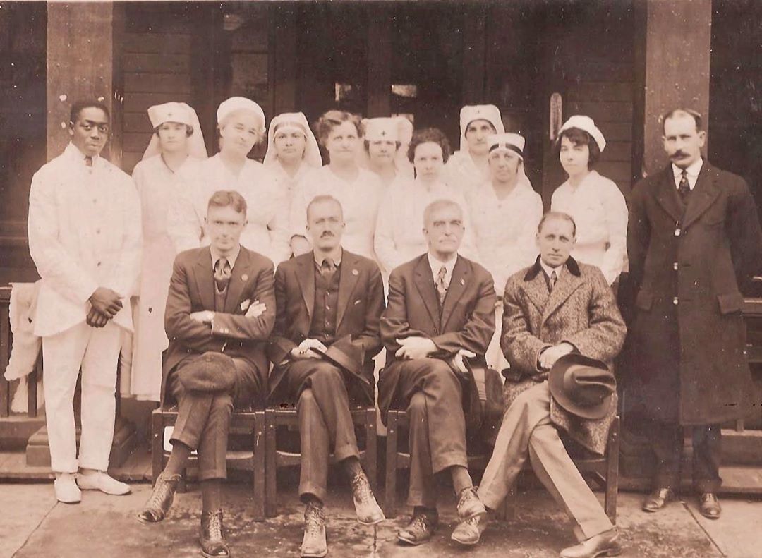 The "influenza staff" at the B&O Hospital next to the YMCA in Brunswick in 1918.  Dr. Levin West and Dr. Harry Slicer Hedges are seated to the left, respectively, on the front row. Lena Sigafoose Troxell is standing with the black band on her hat to the right.  (Courtesy Brunswick History Commission)