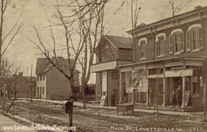 "Main St., Lovetttsville" postcard, 1917, showing from right to left, the store, the Masonic Hall, the Rollins house, and on the far right, the Luther Potterfield house. 